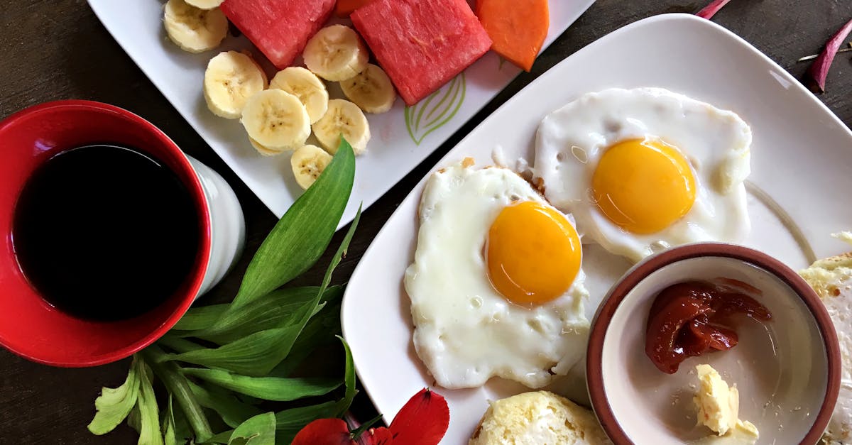 Healthy breakfast featuring eggs, fruits, and coffee arranged beautifully for a vibrant start.