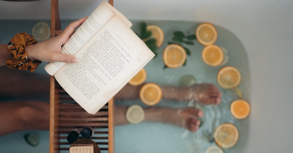 Person enjoying a citrus bath while reading a book, epitomizing relaxation.